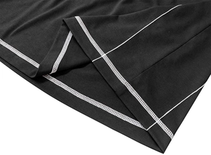 Detail of black knit Henley shirt showing white contrast stitching and flatlock seam structure