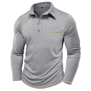 Close-up of contrast khaki stitching on grey long sleeve polo shirt chest pocket