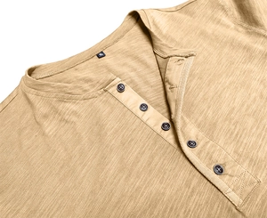 Macro detail of khaki Henley collar with five buttons and textured slub fabric