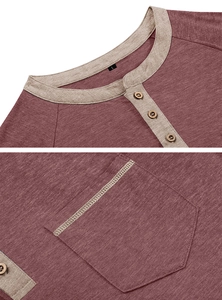 Detail of burgundy Henley shirt showing contrast collar, wood buttons and chest pocket