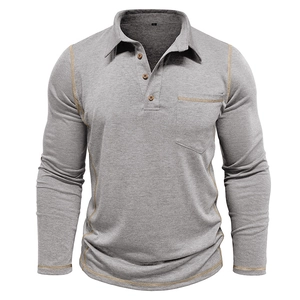 Close-up of grey long sleeve polo shirt featuring contrast stitching and wooden buttons
