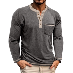 Detail of dark grey Henley shirt featuring a four-button placket and raglan sleeves