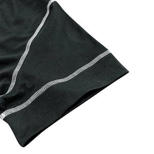 Detail of muscle Henley shirt showing high-quality double-stitch seams and black fabric