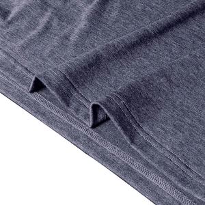 Detailed view of high-density knit fabric and professional double-stitch hem on polo shirt