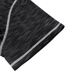 Close-up of melange fabric sleeve with white flatlock stitching on short sleeve Henley shirt