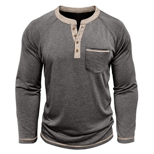 Detail of charcoal grey long sleeve Henley shirt featuring wood buttons and khaki trim