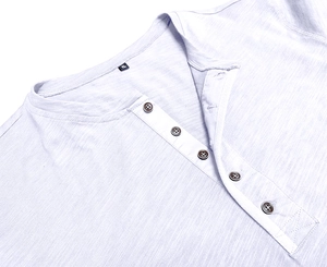 Detail of blue grey Henley neck shirt featuring five buttons and slub fabric texture
