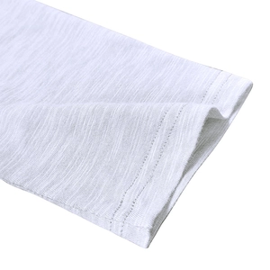 Detail of white slub fabric sleeve with reinforced double stitching on men's shirt