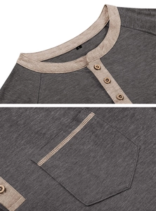 Detail of dark grey Henley shirt with contrast collar and three wood-texture buttons