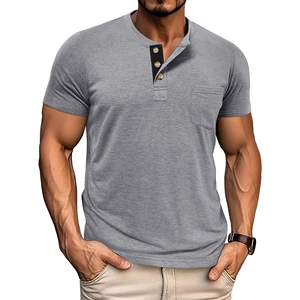 Detail of grey men's short sleeve Henley shirt with three-button contrast placket and chest pocket