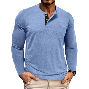 Detail of light blue long sleeve Henley shirt with a three-button placket and chest pocket