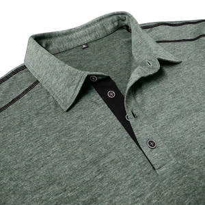 Detail of men's polo shirt collar showing green knit fabric and black contrast placket