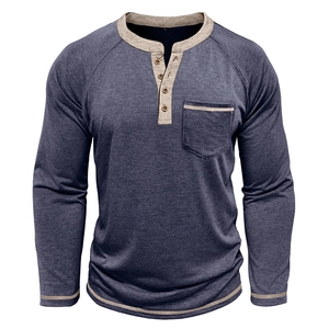 Detail of dark blue Henley shirt with light grey contrast neckline and four wooden buttons