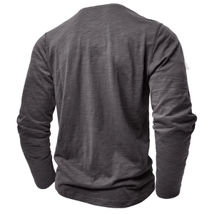 Rear view of dark grey long-sleeved shirt showing natural slub cotton fabric texture