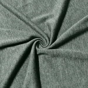 Macro texture detail of grey-green marl knit fabric with soft fiber layers