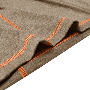 Macro shot of grey-brown knit fabric featuring bright orange flatlock stitching details
