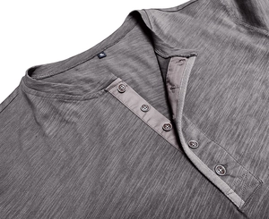 Close-up of grey Henley shirt neckline showing vertical slub texture and five dark buttons