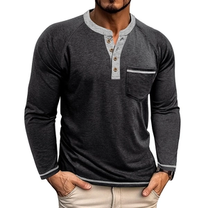Detail of grey raglan Henley shirt featuring four buttons and a contrast pocket
