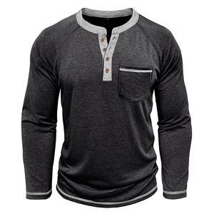 Detail of grey Henley shirt showing contrast stitching and wood-textured buttons
