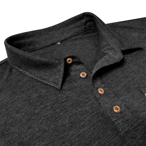 Detail of dark charcoal long sleeve polo shirt showing wooden buttons and knit texture