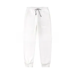 Detail of white cotton sweatpants featuring an elastic drawstring waist and ribbed ankle cuffs