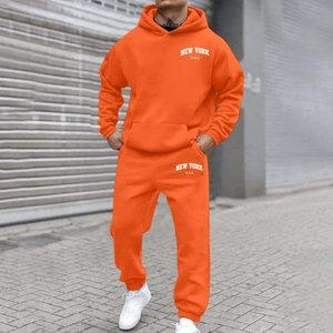 Bright orange fleece hoodie and sweatpants set with New York print for casual streetwear