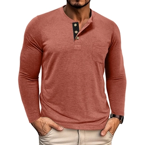 Detail of rust red Henley shirt featuring contrast black placket and wood buttons