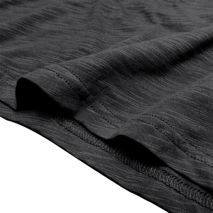 Detail of dark grey slub cotton shirt showing textured knit fabric and double stitching