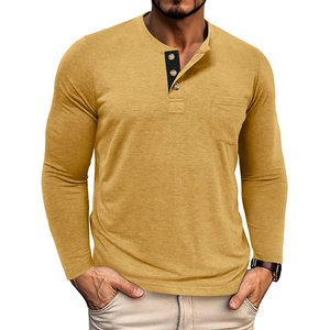 Close-up of mustard yellow men's Henley shirt with black contrast placket and chest pocket