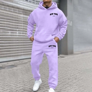 Outdoor street shot of a light purple fleece hoodie and joggers set with NEW YORK print