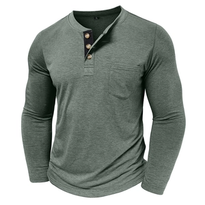 Detail of olive green Henley shirt featuring wood texture buttons and chest pocket