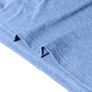 Detail of blue knitted long sleeve polo shirt showing fabric texture and double stitching
