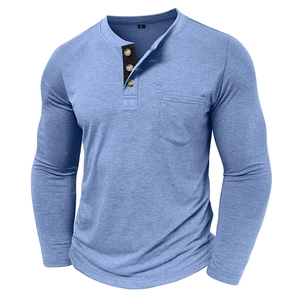 Detail of light blue Henley shirt with three buttons, chest pocket, and knit texture
