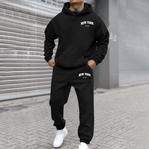 Close-up of New York U.S.A. white letter print on black drawstring hoodie and joggers