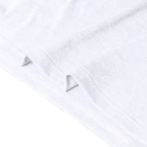 Close-up of double-needle stitching detail on the hem of a white long-sleeve polo shirt