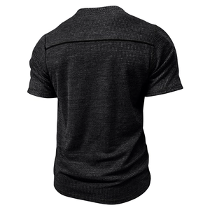Rear view of dark grey men's waffle knit T-shirt showing texture and shoulder seam