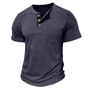 Detail view of men's dark grey blue knit Henley shirt with three-button placket and pocket