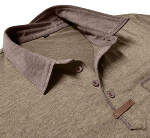 Close-up of men's polo shirt featuring a classic collar and a small leather detail