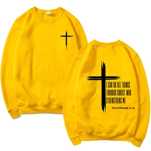 Detail view of yellow hoodie with cross print and Philippians 4:13 verse text on back