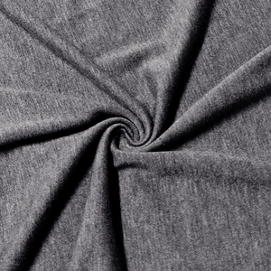 Detail showing the heather grey knitted fabric texture and premium fiber grain