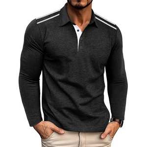 Detail of dark grey polo shirt showing shoulder stripes and white button placket
