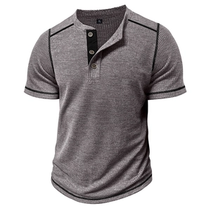 Detail of grey waffle knit Henley shirt with contrast stitching and three-button placket