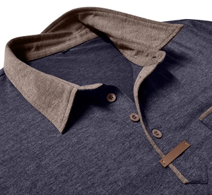 Close-up of charcoal grey knit polo shirt with contrast tan collar and leather pocket detail