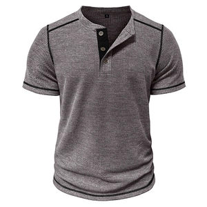 Detail of grey waffle knit henley shirt showing black contrast placket and button stitching