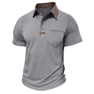 Detail of grey men's polo shirt with brown contrast collar and leather pocket trim