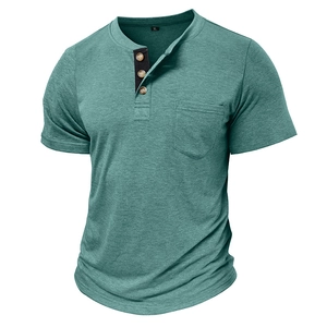 Detail of greyish green Henley shirt with three wood buttons and functional chest pocket