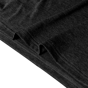Close-up of dark grey knitted fabric showing double-needle stitched hem and texture