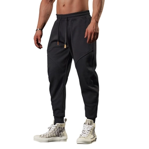 Close-up of ergonomic stitching and premium knit fabric on black athletic jogger pants