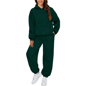 Detailed close-up of dark green hooded sweatshirt and matching joggers set for women