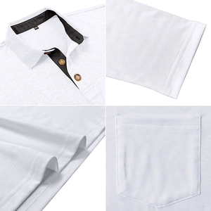 Detail view of white polo shirt featuring black contrast collar and buttoned chest pocket